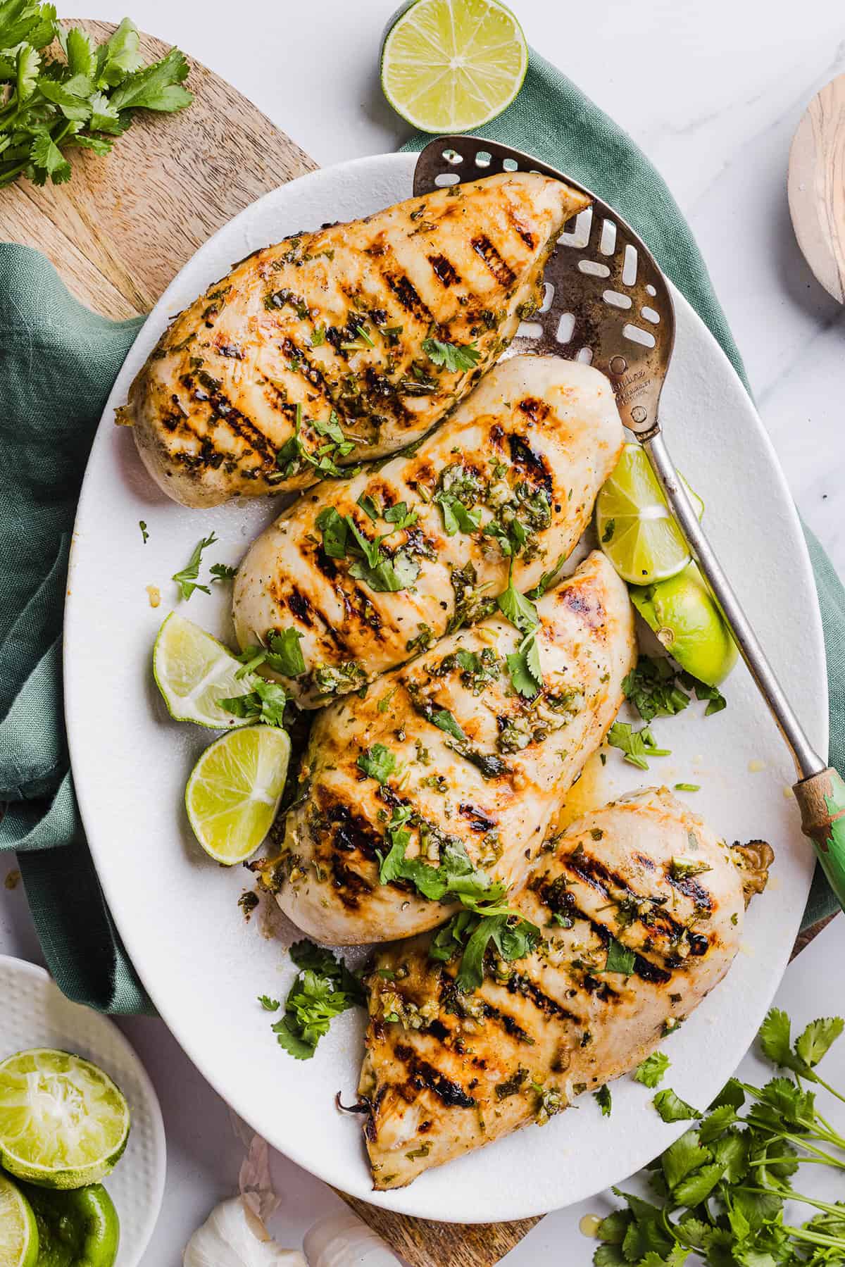 This Cilantro Lime Grilled Chicken Recipe is packed with so much zesty flavor and easily made with just a few simple ingredients! A delicious, healthy meal you can serve in tacos, on salads or over rice.