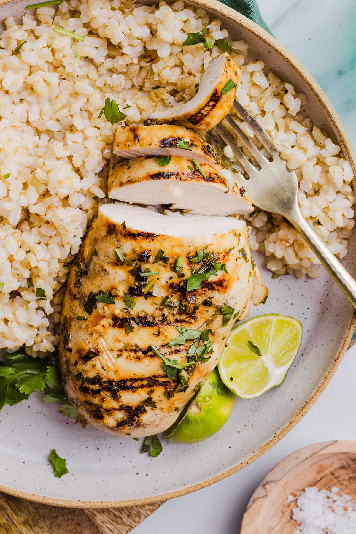 This Cilantro Lime Grilled Chicken Recipe is packed with so much zesty flavor and easily made with just a few simple ingredients! A delicious, healthy meal you can serve in tacos, on salads or over rice.