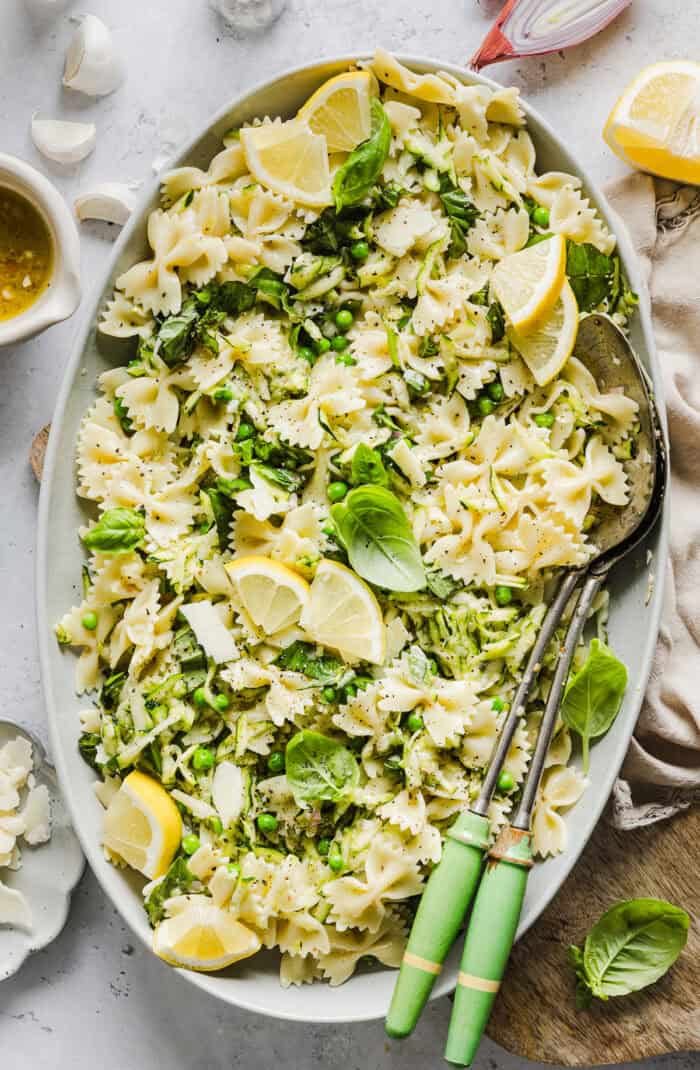 Add this light and zesty Lemon Basil Pasta Salad to your summer menu! This pasta salad is refreshing, flavorful and packed with fresh veggies. The perfect side dish to bring to your next cookout or picnic and makes a healthy weeknight dinner!