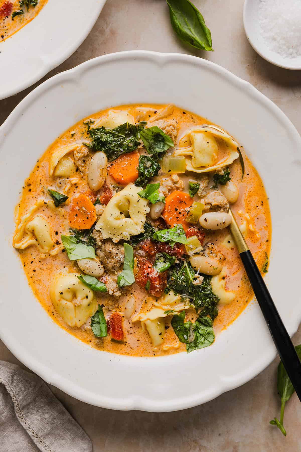 This Creamy Tortellini Soup is cozy, comforting and made with tender cheese tortellini, fresh veggies, herbs and a rich creamy broth. The perfect one pot meal that is both flavorful and satisfying!