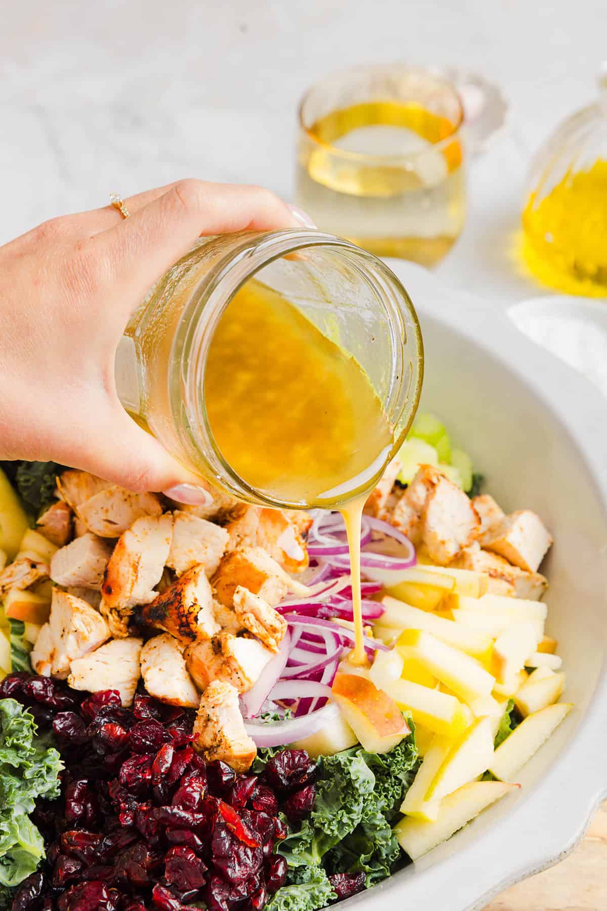 This fresh and flavorful Harvest Chopped Chicken Salad is made with leafy kale, tender juicy chicken, chopped apples and crunchy pecans all tossed with a maple dijon dressing! This salad is hearty enough for dinner and light enough for lunch!